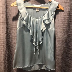 Pretty sleeveless silk blouse with front open ruffle detail and side zipper